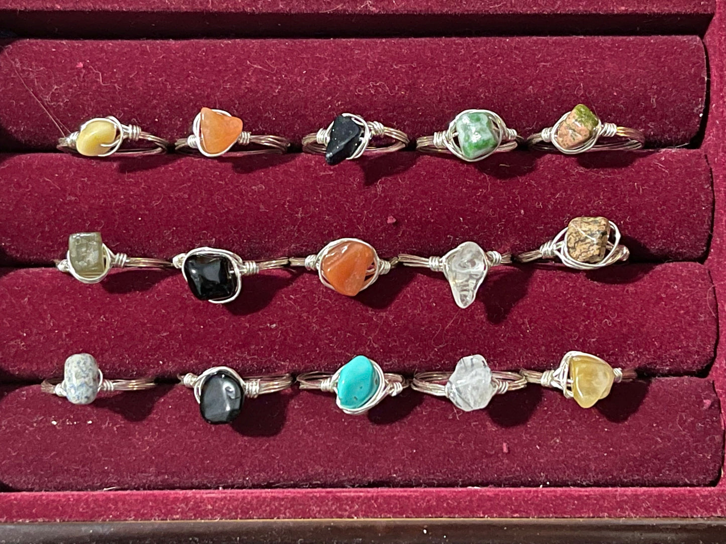 a collection of rings in a red box